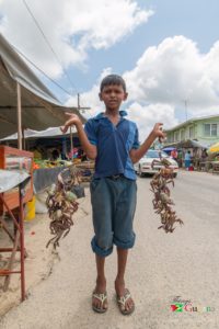 Lad selling crabs at the Mahaica Market. 